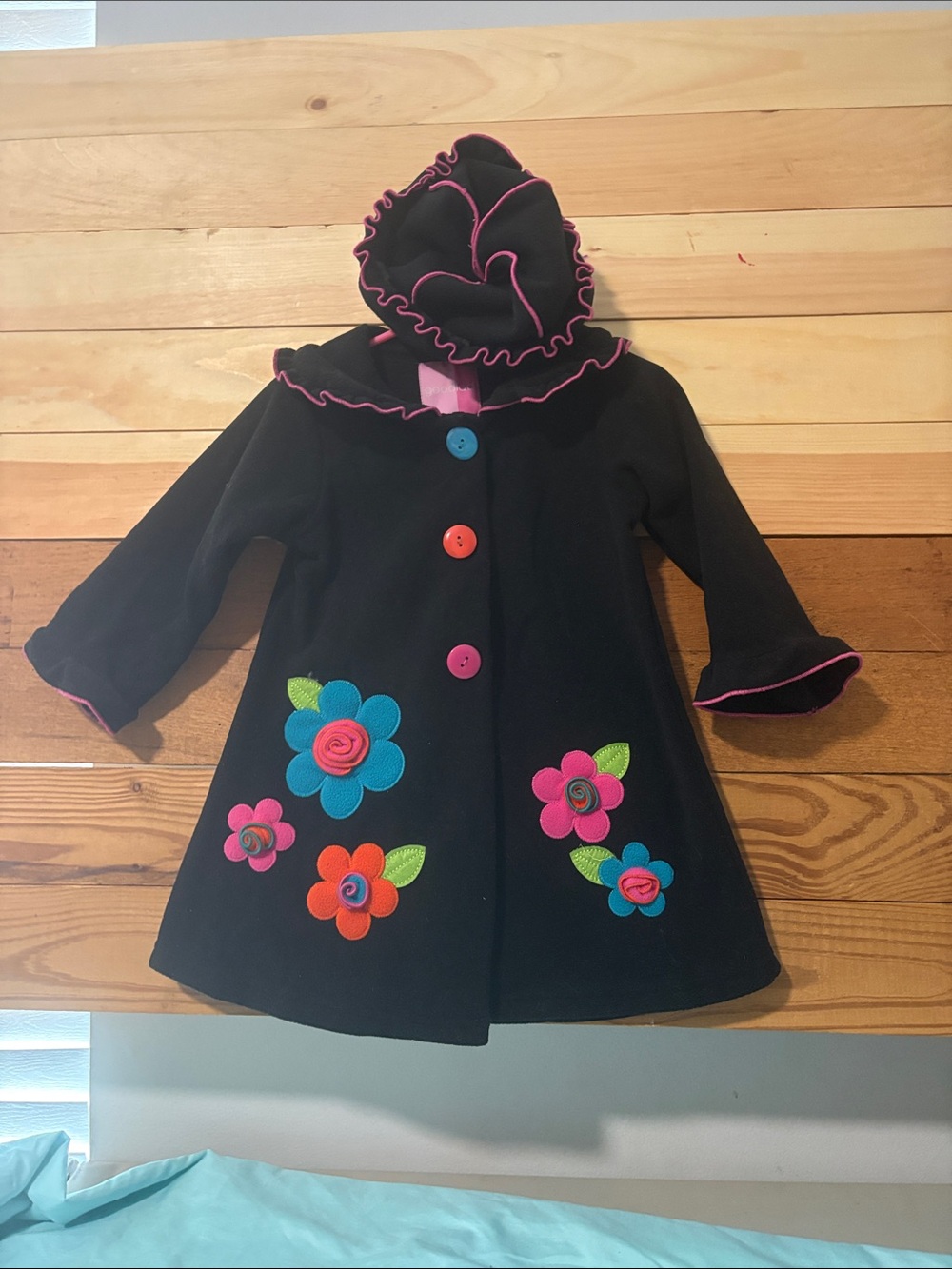 Good Lad Black Coat with Pink Trim and Bright Floral Appliqués